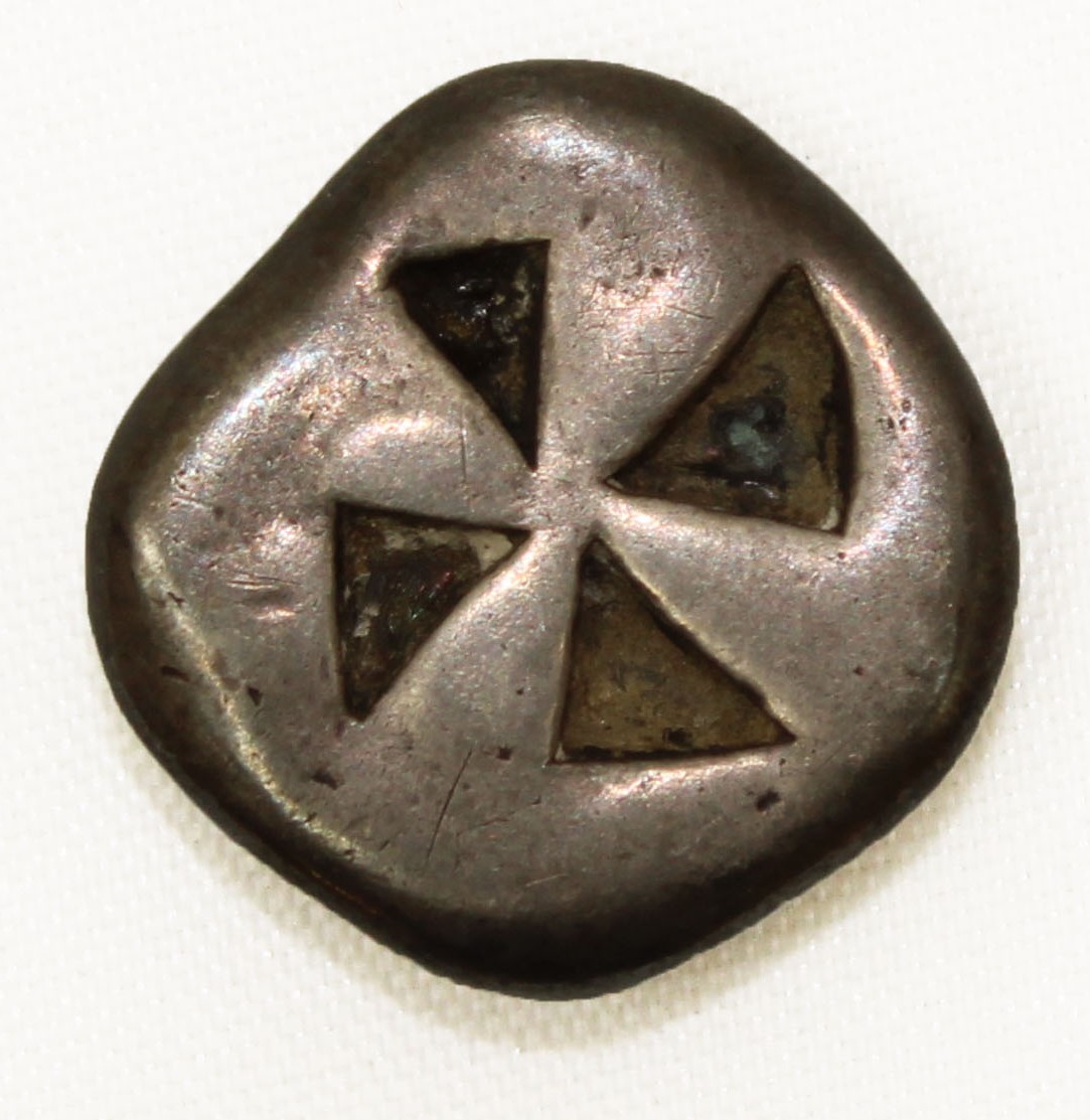 A silver stater from Aegina with a mill sail design.
