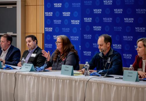 panelists in business leadership seminar