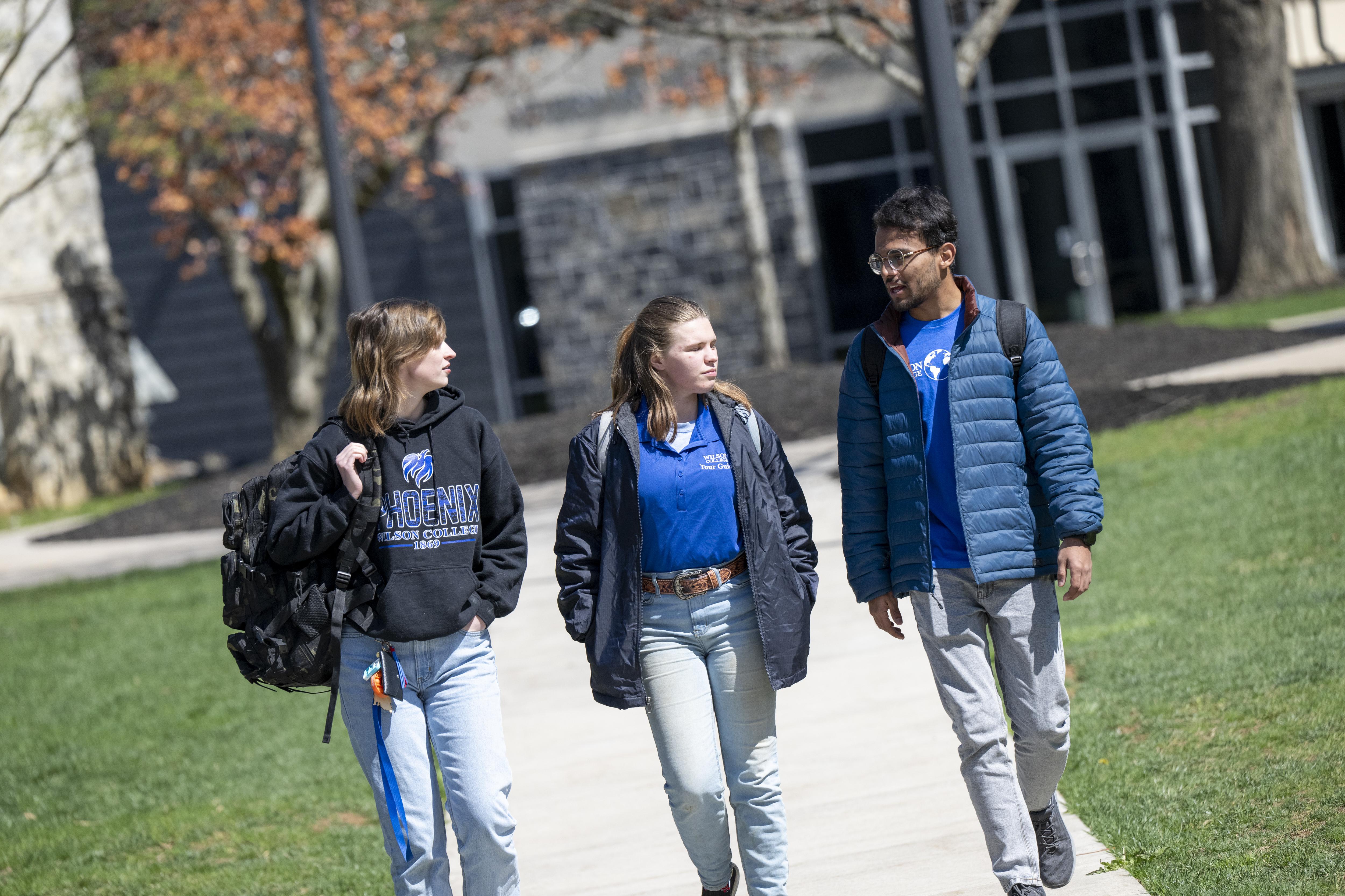 three students on campus
