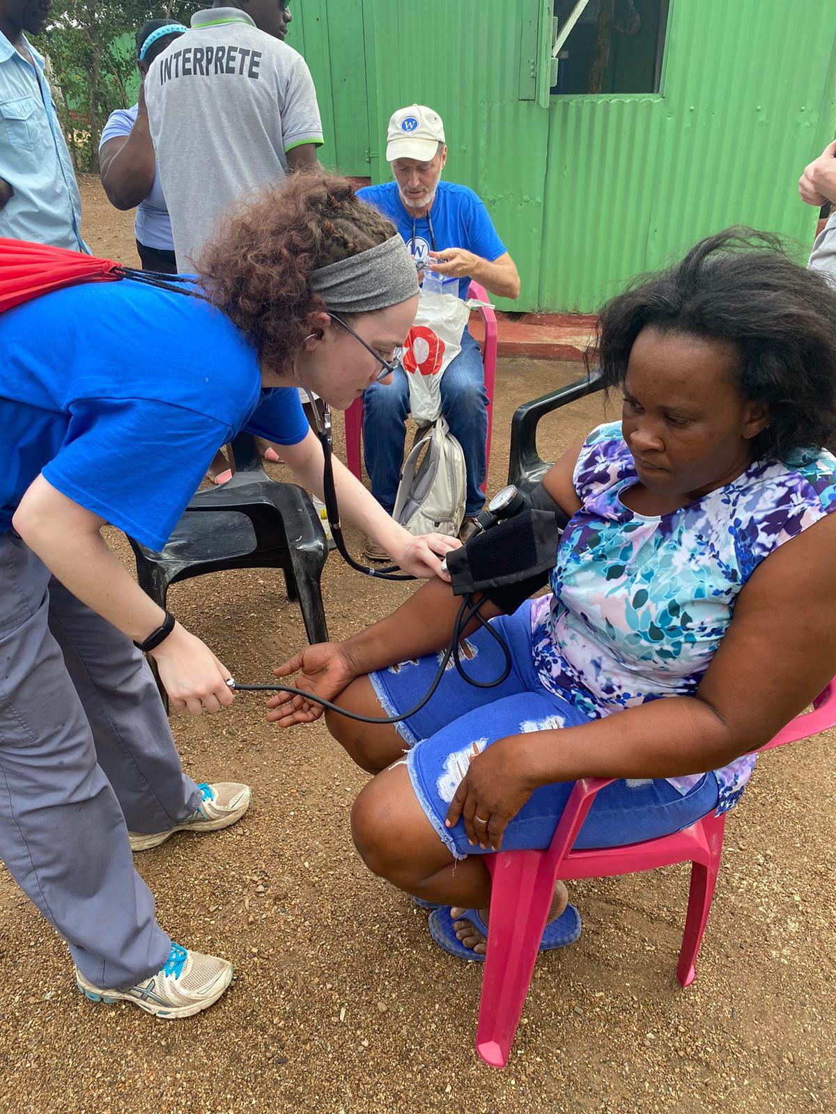 Student taking blood pressure