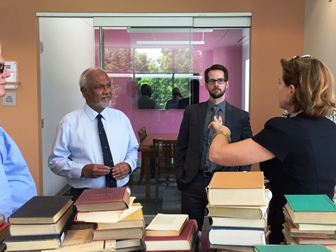 Tissa Jayatilaka, executive director of the United States-Sri Lanka Fulbright Commission, tours Wilson's John Stewart Memorial Library.